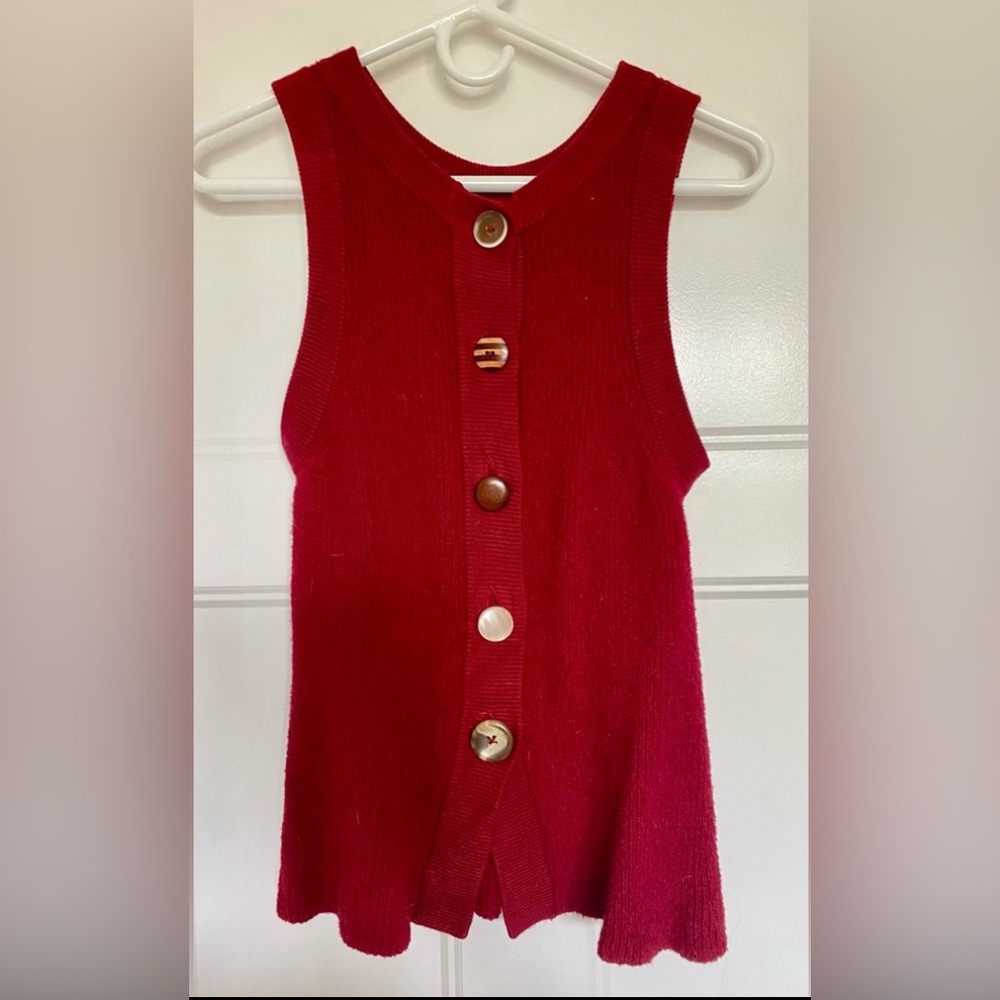 ANTHROPOLOGIE Burgundy sleeveless sweater with decorative buttons up the back.